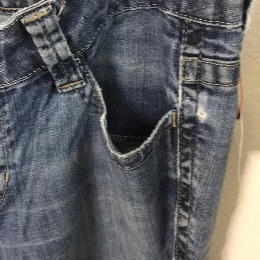 Calvin Klein distressed medium dark wash jeans 10